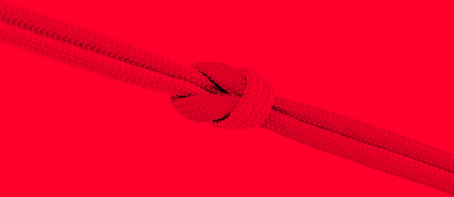 interdependence shown by two strands looped into each other on a red background